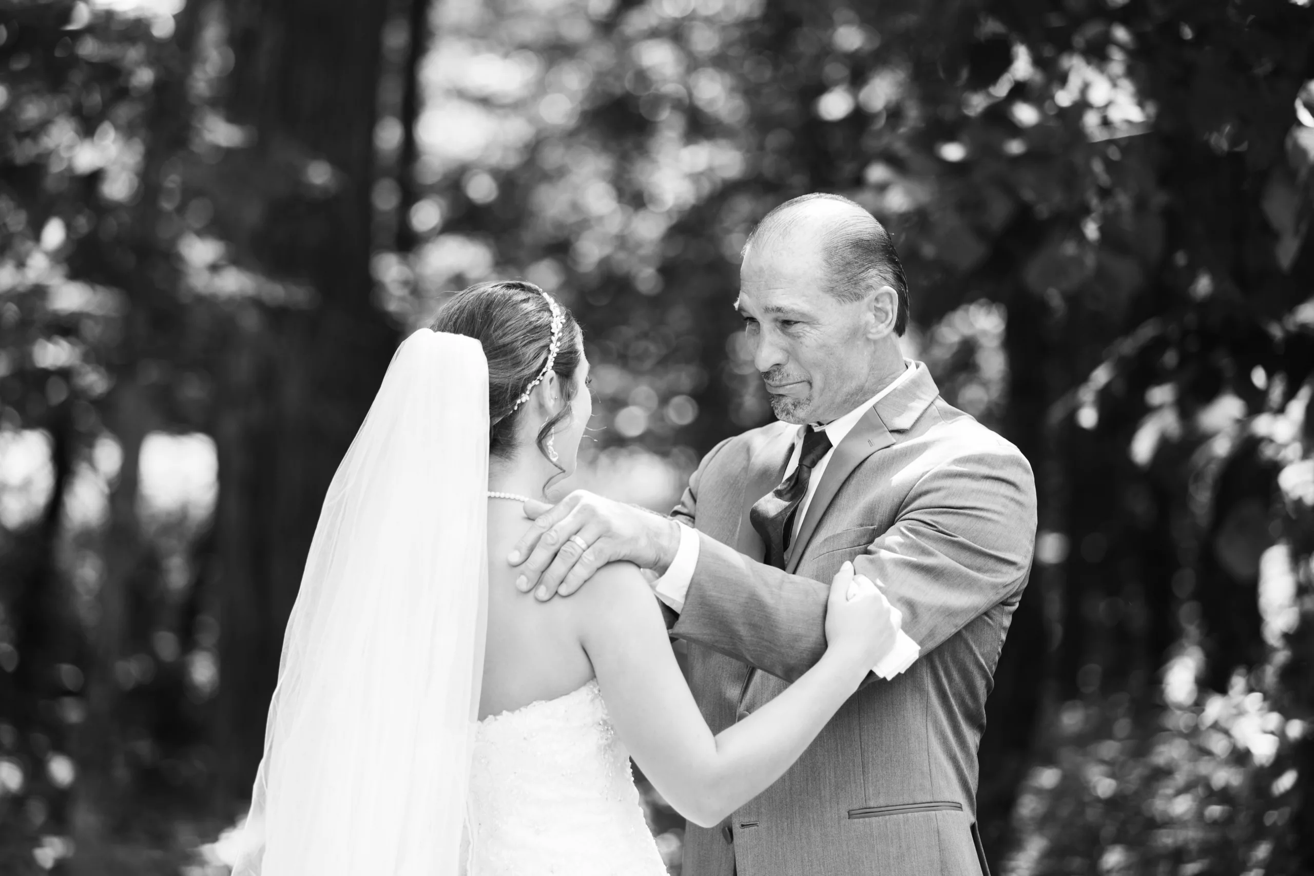 Candid moment between dad and bride at Country Lane Lodge in Adel Iowa 