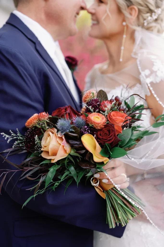Wedding bouquet inspiration with beautiful jewel tones and fall colors in Iowa City at the Heights Rooftop 